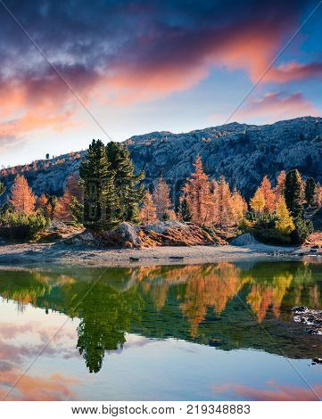 Splendid view of Limides Lake. Colorful autumn morning in Dolomite Alps Falzarego pass Cortina d'Ampezzo lacattion Italy Europe. Artistic style post processed photo.