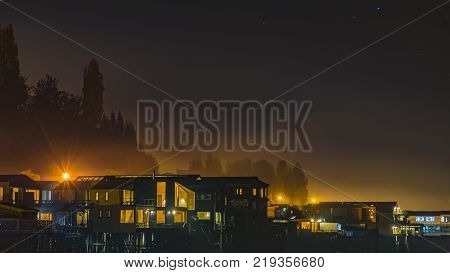 Night Scene Palafito Houses At Lake, Chiloe, Chile