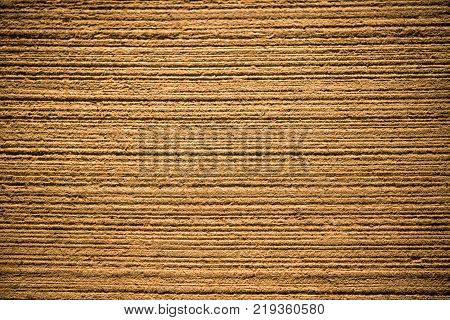 Concrete gold abstract background with lined texture