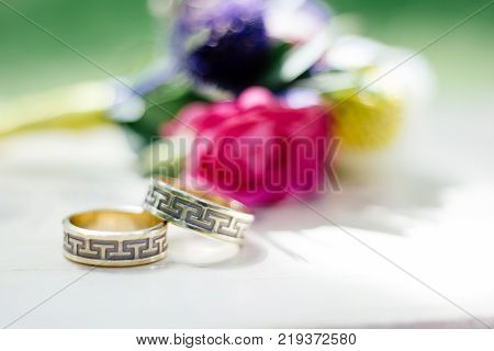 The wedding rings with flowers, marriage concept.