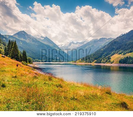 Colorful summer morning on the Speicher Durlassboden lake. View of Richterspitze mountain range in the Austrian Alps Schwaz district in the Tyrol state Austria Europe. Artistic style post processed photo.
