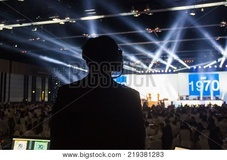 Silhouette of worker control, sound system and lighting in concert.