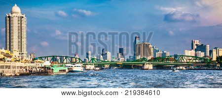 Business district cityscape from Chao Phraya River in Bangkok Thailand.