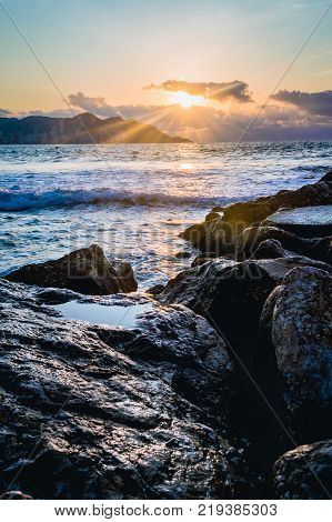 Spectacular sunrise captured at Mediterranean Sea on Poniente Beach in Benidorm, Spain.