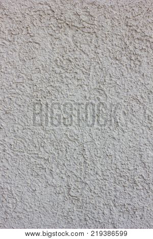 Concrete wall texture. Wheathered plaster background grey color