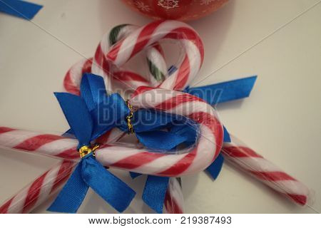 Christmas decorations with adornment sugar sticks with blue ribbon