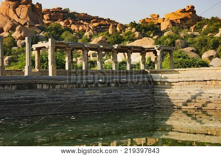 Pushkarani is a sacred lake on the way to the Vitthala temple in Hampi, Karnataka, India. The pond served to the ritual and functional aspects of the temple and life surrounding it.