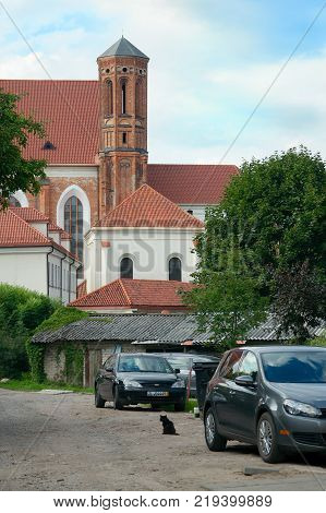 Vilnius Lithuania - August 16 2017: Yard in Užupis and view on the back of Church of St. Francis and St. Bernard (1516).