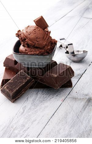 chocolate ice cream scoops with pieces of chocolate and waffle cones