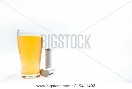 Effervescent tablets tube with blank label and orange effervescent bubbles of calcium and vitamin C in transparent glass. Vitamins minerals and supplement concept.
