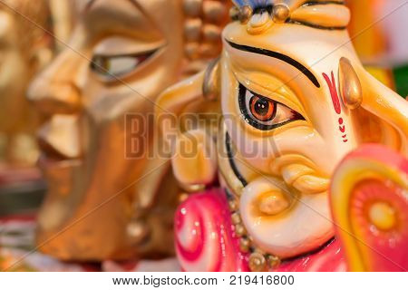 Colorful dolls made of clay Lord Ganesha handicrafts on display during the Handicraft Fair in Kolkata earlier Calcutta West Bengal India. It is the biggest handicrafts fair in Asia.