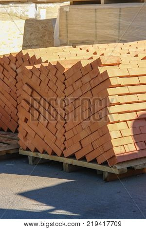 New bricks on pallete on construction market.