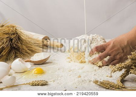 dough with close-up. man is preparing bread dough