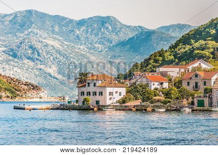View on the coast from ferry transporting cars and people in Lepetane, Tivat, Montenegro.