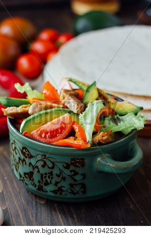 Vegetarian variant of mexican fachitos on wooden board.
