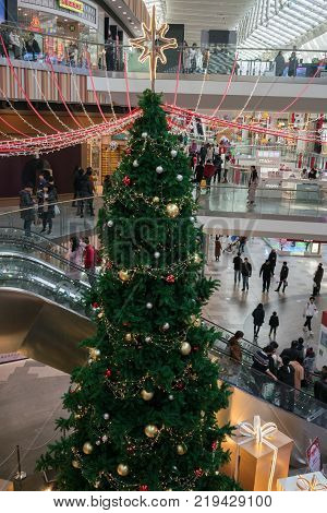 Wuhan Hubei China, 24 December 2017: Christmas tree and decorations inside Livat modern shopping mall in China on Christmas eve