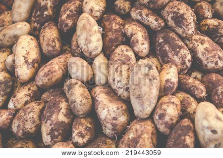 Patatoes lined on a counter of open market