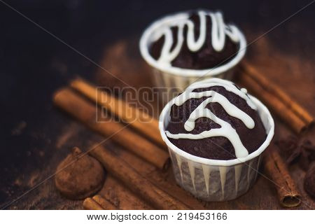 homemade spicy chocolate cupcake sweets and spices mess on the table