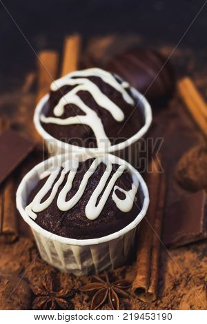 homemade spicy chocolate cupcake sweets and spices mess on the table