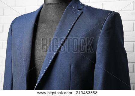 Semi-ready suit on mannequin indoors, closeup