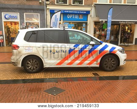 Steenwijk, The Netherlands - December 24, 2017: Dutch National Police Car (politie), Volkswagen Touran, parked on a city street in the center of Steenwijk.