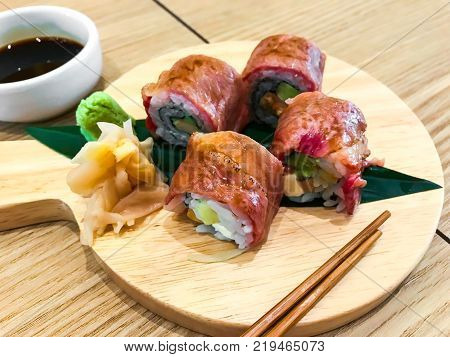 Meat sushi rolls with beef. Studio Photo