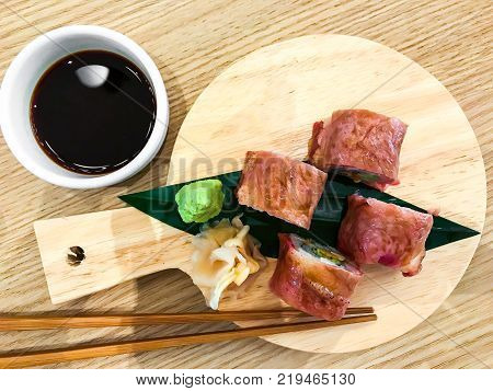 Meat sushi rolls with beef. Studio Photo