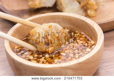 close up of crispy fried taro and wooden stick