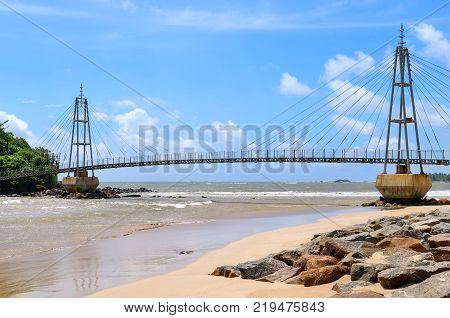 Bridge to the island with a Buddhist temple Matara Sri Lanka