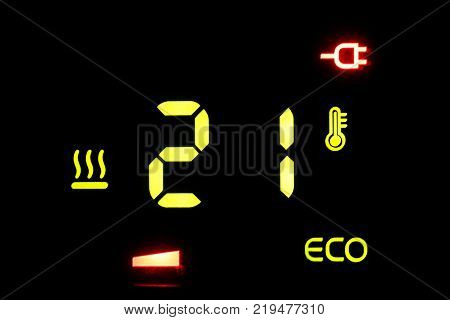 on a black electronic thermometer display -21 degrees Celsius