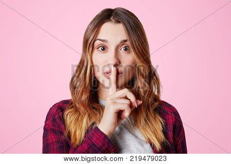 Headshot Of Unhappy Sorrorful Female Curves Lips, Looks Desperately At Camera, Being Upset To Hear B