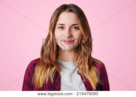 Headshot Of Unhappy Sorrorful Female Curves Lips, Looks Desperately At Camera, Being Upset To Hear B