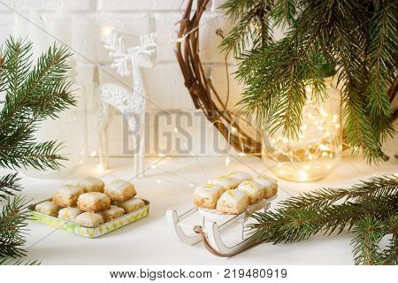 Christmas cookies ginger cubes in festive decoration. Rustic style, selective focus.