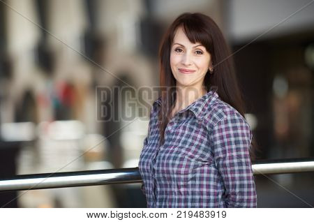 happy woman standing in a shopping mall. half-length portrait.