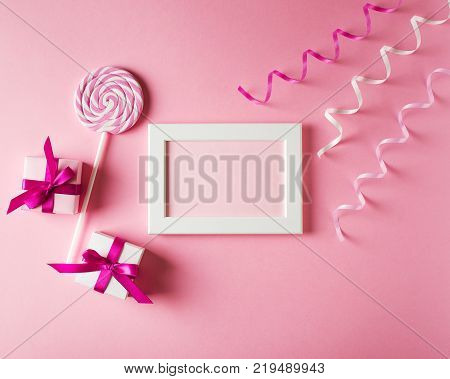 Valentines and birthday card with gift lollipop and poster on pink background. Moke up