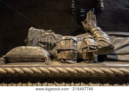 Lisbon Portugal August 6 2017: Tomb of navigator Vasco da Gama carved by Costa Mota in 1894 located in the in the southern lateral chapel of the Jeronimos Monastery