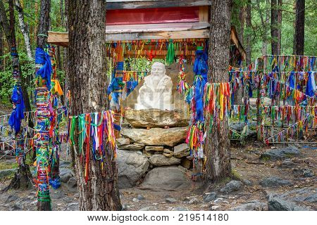 Statue Sagaan Ubgen White Old Man is near Source of mineral water in Arshan. Buryatia. Russia