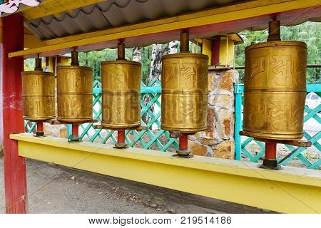 Prayer cylinders in Buddhist datsan Dechen Ravzhalin in Arshan. Buryatia. Russia