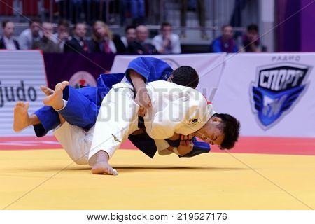 ST. PETERSBURG, RUSSIA - DECEMBER 16, 2017: Final fight Soichi Hashimoto, Japan (white) vs Lasha Shavdatuashvili, Georgia during Judo World Masters tour. Hashimoto won gold medal