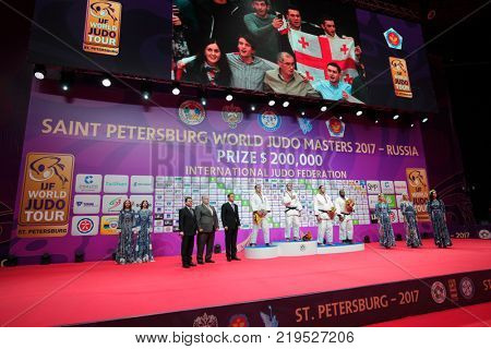 ST. PETERSBURG, RUSSIA - DECEMBER 17, 2017: Winners in Men O100 during award ceremony of Judo World Masters 2017. Left to right on podium: Moura, Tushishvili, Silva, Mendoza