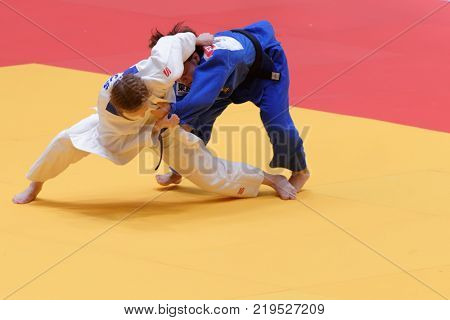 ST. PETERSBURG, RUSSIA - DECEMBER 16, 2017: Final fight Funa Tonaki, Japan (blue) vs Irina Dolgova, Russia during Judo World Masters tour. Tonaki won gold medal