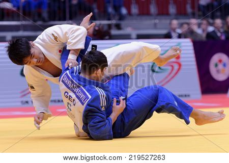 ST. PETERSBURG, RUSSIA - DECEMBER 16, 2017: Final fight Soichi Hashimoto, Japan (white) vs Lasha Shavdatuashvili, Georgia during Judo World Masters tour. Hashimoto won gold medal