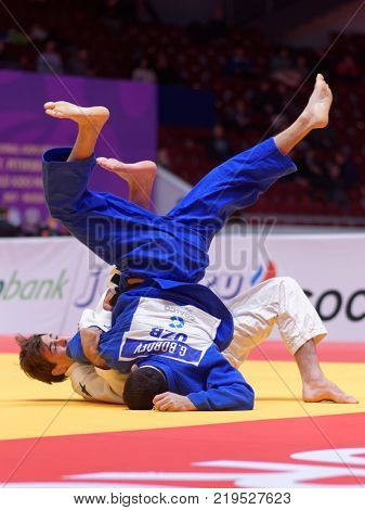 ST. PETERSBURG, RUSSIA - DECEMBER 16, 2017: Fight for 3rd place Tommy Macias, Sweden (white) vs Giyosjon Boboev, Uzbekistan during Judo World Masters tour. Macias won bronze medal