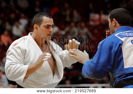 ST. PETERSBURG, RUSSIA - DECEMBER 17, 2017: Final fight Guram Tushishvili, Georgia (blue) vs David Moura, Brazil during Judo World Masters tour. Tushishvili won gold medal