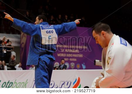 ST. PETERSBURG, RUSSIA - DECEMBER 17, 2017: Final fight Guram Tushishvili, Georgia (blue) vs David Moura, Brazil during Judo World Masters tour. Tushishvili won gold medal