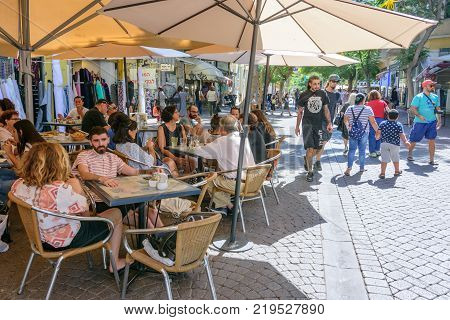 People Sitting In An Outdoor Cafe In Tel Aviv