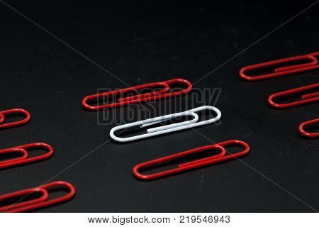 row of paper clip on black background different concept