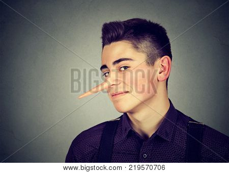 Liar funny looking young man with long nose