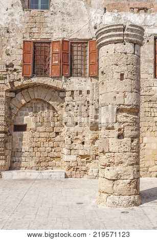 Ancient theater view of ruins of a pillar in Rhodes town on Rhodes island Greece