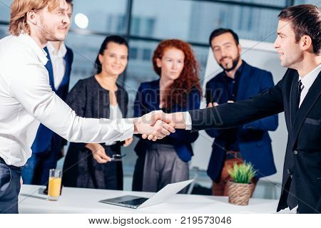 Business handshake. Business handshake and business people concept. Two men shaking hands